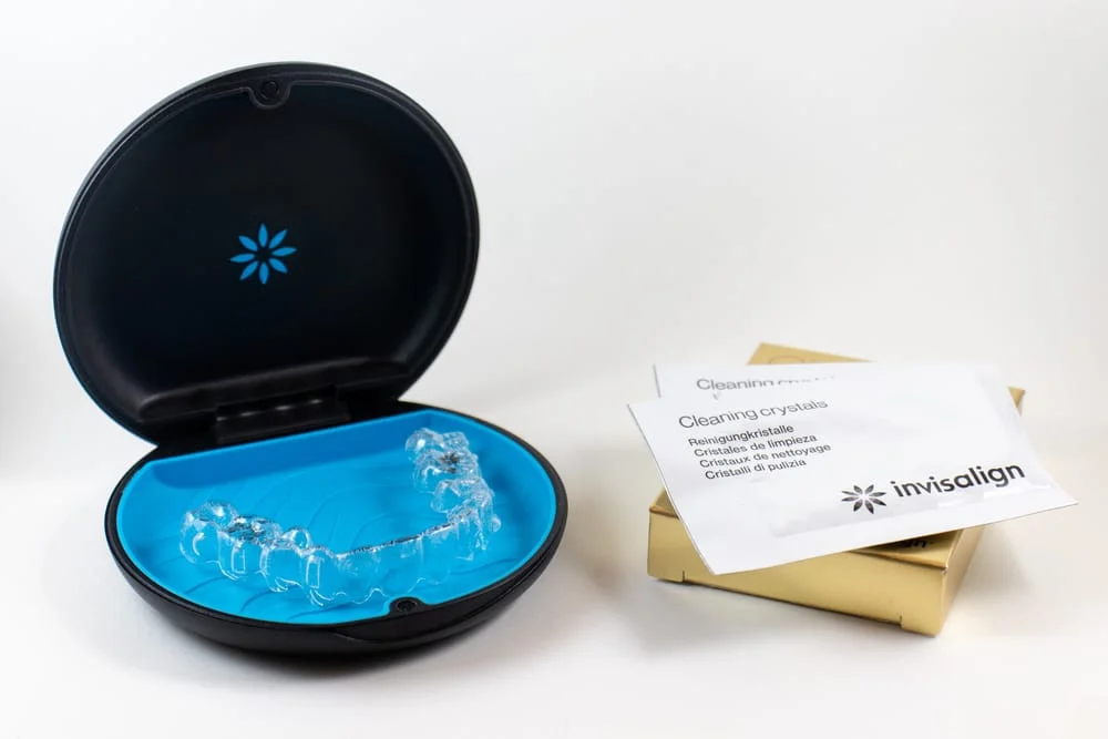 Items included in an Invisalign care package.